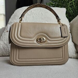 Coach Quilted Snake Marley Top Handle In The Color Taupe